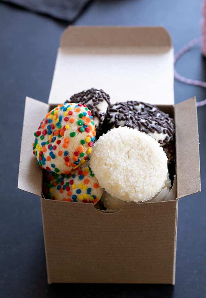 decorated drop sugar cookies in a square brown Kraft box